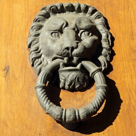 beautiful old door knocker in Florence, Tuscany, Italy, Europe