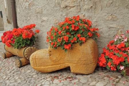 handmade wooden planters for flowering plants on country backyard, Italy, Europeの写真素材