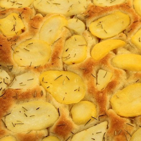 Focaccia with potatoes and rosemary on italian market, focaccia is traditional flat oven baked  breadの写真素材