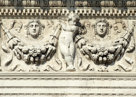 bas-relief  with angel holding  garland wreath  on the facade of the Biblioteca Nazionale Marciana  ...