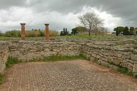 gloomy landscape with ruins of ancient city Paestum, Italyの写真素材
