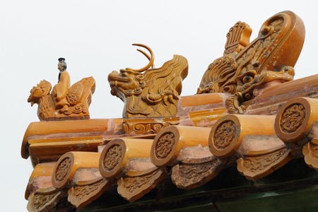 Imperial roof decoration of a minor building ,At the head of the procession  a man riding a Phoenix and the imperial dragon,Summer Palace in Beijing, China, Asiaのeditorial素材