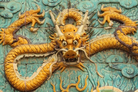 dragon decoration - in glazed ceramic - on wall in Forbidden City in Beijing, China, Asiaの写真素材