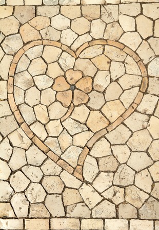 traditional portuguese decorative small tiles mosaic with heart and flower on pavement in Belem , Lisbon,Portugal, Europeの写真素材