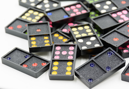 colorful scattered dominoes on white backgroundの写真素材
