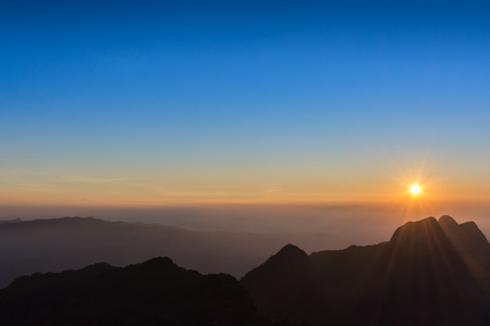 sunset over high mountain in thailandの写真素材
