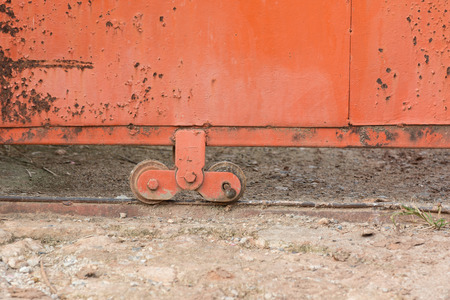 Old wheel of metal slide doorの写真素材