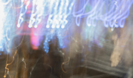 futuristic abstract glowing background resembling motion blurred neon light curvesの写真素材