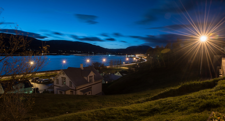 night cityscape of Egilsstadir city,East of Iceland with lensflare
