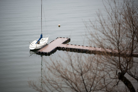 The Nice view of a sightseeing boat cruising on autumn Lake Kawaguchiko.の写真素材