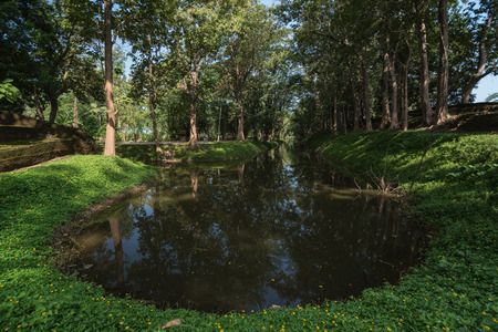 Moat or small canal of Chiang saen district ancient wall next to ancient pagoda at Wat pha sak temple,Chiang san,Thailandの写真素材