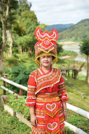 CHIANG RAI,THAILAND - JANUARY 3 : Unidentified Mong tribe young woman with traditional clothes and silver jewelery in hill tribe minority village on January 3, 2017. Chiang Rai, Thailand.のeditorial素材