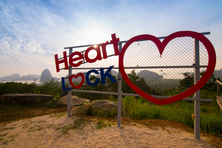 Padlock loop hearth sign on viewpoint at travel destination in mountain and river view.の写真素材