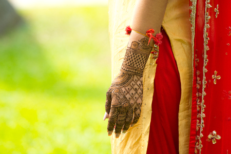 Henna artwork on hands of Indian wedding brideの写真素材