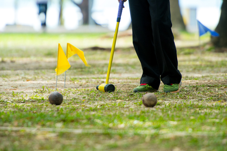 Woodball, sport equipment, Sports Woodball a way to play a sport like golf Woodball is played with a mallet whose head looks remarkably like a wooden beer bottle.の写真素材