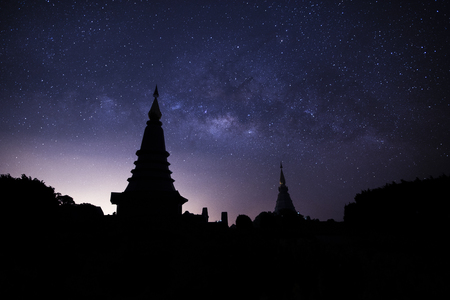 Milky way galaxy with stars on night sky ; silhouette of The Great Holy Relics Pagoda Nabhamethanidol and Nabhapolbhumisiri at Doi Inthanon Chiang Mai, north of Thailand.の写真素材