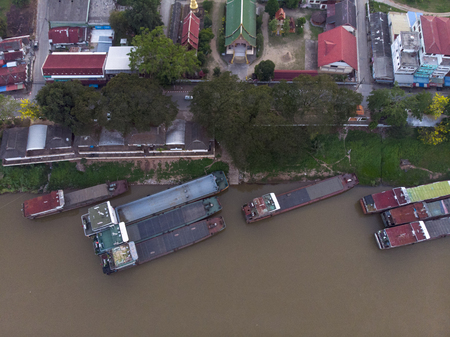 top view of drone camera of Laos transportation boats parking at golden triangle port of Chiang saen,Chiang rai,Thailandの写真素材