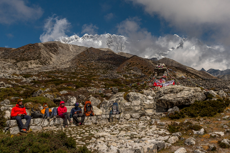 Trekker with landscape of mountain and river on the way from Dingboche to Lobuche in the everest base camp region,Nepalのeditorial素材
