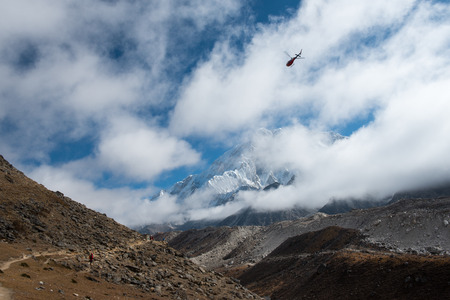Mountain and route of everest base camp with helicopter on the way from Lobuche to Gokyo,Nepal.の写真素材