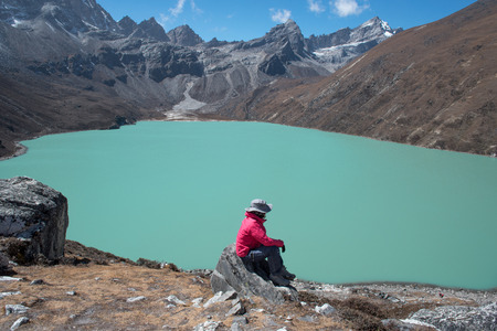 Trekker on the way from Lobuche to Gokyo village with Naktok lake and mountain in everest base camp trek route regionの写真素材