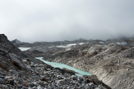 beautiful green water in glacier on the way to Gokyo village with snow mountain on everest base camp route region,Nepalの写真素材