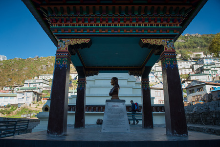 Namche Bazaar,Nepal - October 14,2018 : hiking backpacker walk in Namche bazaar near statue of Lady sherpa, Nepalのeditorial素材