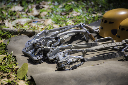 Safety belts with carbines and helmet. obstacle course equipment for outdoor activity and sport.