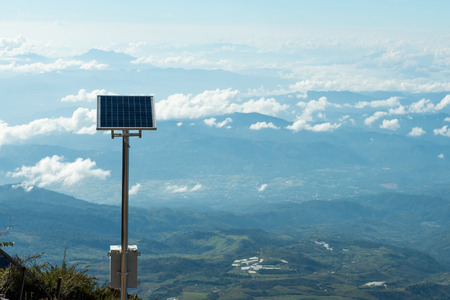 Solar cell on top of mountain,save the world and energy concept.