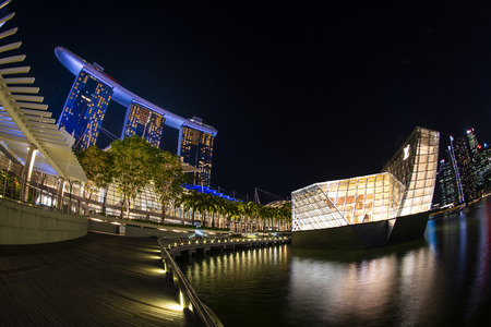 Marina bay,Singapore - 2017 September 21 : Illuminated of Marina bay sand and louis brand shop in marina bay at night,Singaporeのeditorial素材