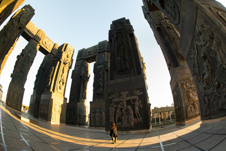 Asian traveler woman looking up chronicle of Georgia landmark with travel destination in Tbilisi Georgia.のeditorial素材