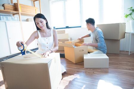 startup small business owner at workplace. freelance asian man and asian woman seller check product...