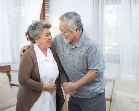 Portrait of elderly senior asian couple happy together at home.の写真素材