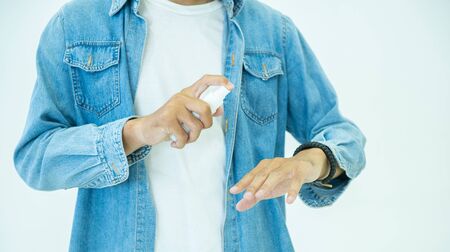 Asian man wash hands antiseptic protect virus or bacteria.patient with mask prevent from corona...
