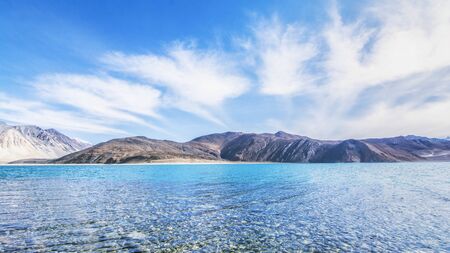 Beautiful exotic summer landscape of blue sky mountain and lake with reflection of cloud.の写真素材