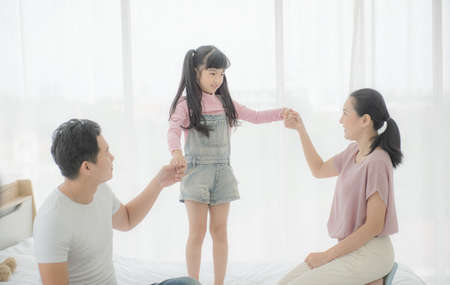 Education concept.Portrait enjoy happy smiling love asian family father and mother with little asian...