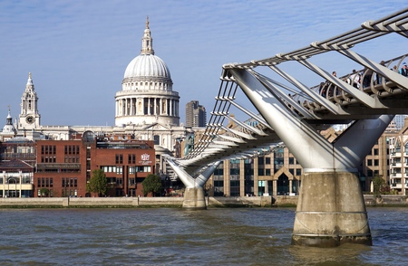 LONDON, UK - OCTOBER 11 2015: Pedestrians cross the Millennium Bridge towards St Paul's Cathedral and the independent City of London School.のeditorial素材