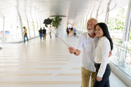 Mature multi-ethnic couple happy and in love while exploring theの写真素材