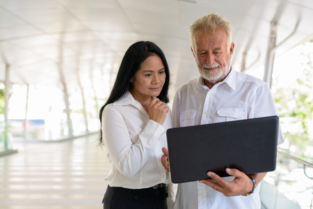 Mature multi-ethnic couple happy and in love while exploring theの写真素材