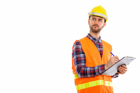 Young handsome bearded man construction worker