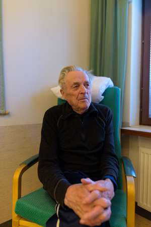 Senior man relaxing at nursing home in Turku, Finlandの写真素材
