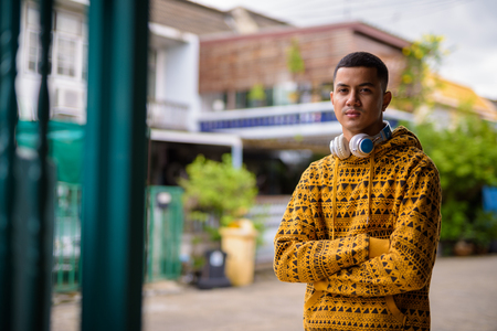 Young multi-ethnic Asian man in the streets outdoorsの写真素材