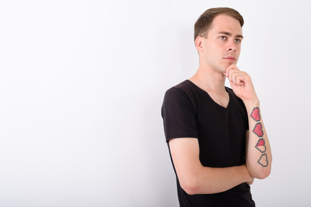 Young handsome man against white backgroundの写真素材