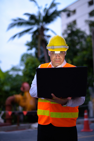Handsome Persian man construction worker at the construction sitの写真素材
