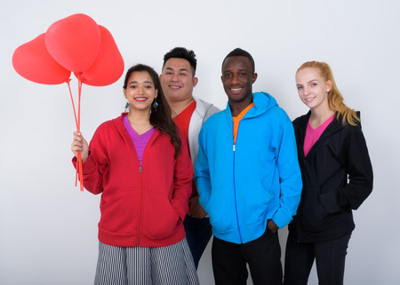 Studio shot of happy diverse group of multi ethnic friends smiliの写真素材