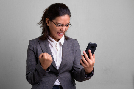 Portrait of young beautiful Asian businesswoman wearing eyeglassesの写真素材