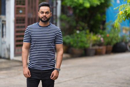 Young bearded Indian man in the streets outdoorsの写真素材
