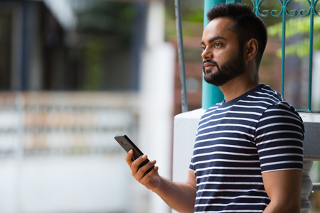 Young bearded Indian man in the streets outdoorsの写真素材