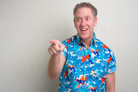 Portrait of mature tourist man ready for vacationの写真素材