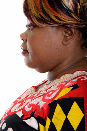 Profile view of face of fat black African womanの写真素材