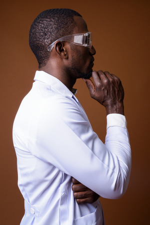 Handsome African man doctor wearing protective glassesの写真素材